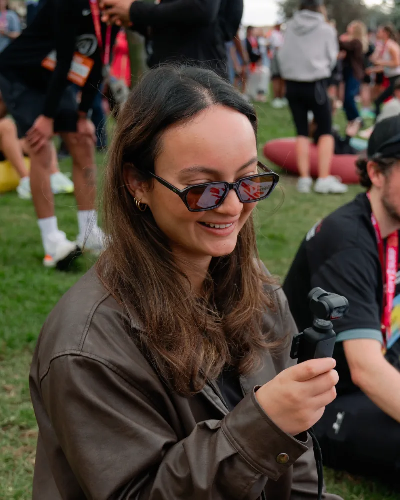 Brooke Nicotra, social media manager, filming on location at City2Surf